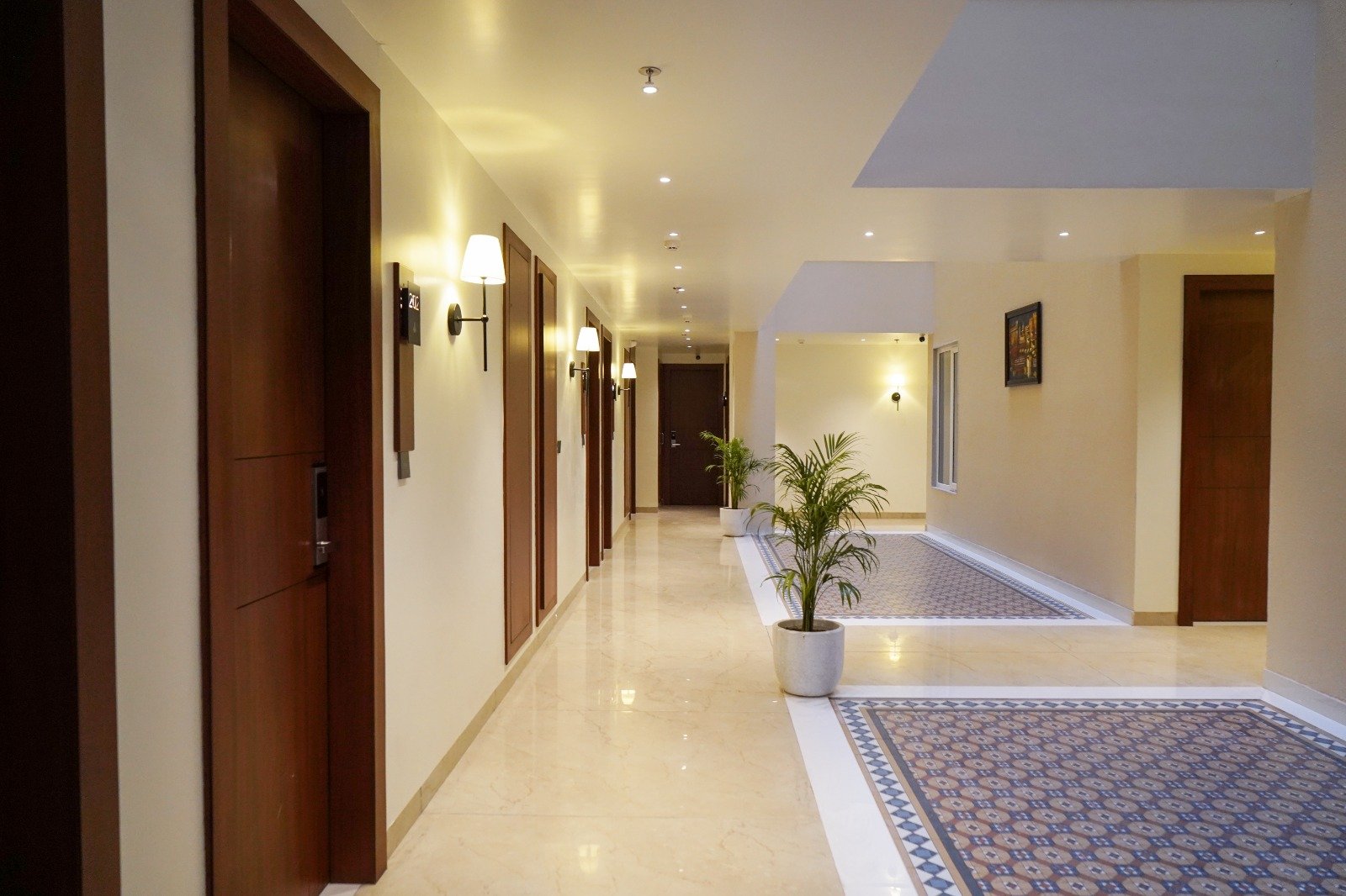 Corridor with Warm Sconces